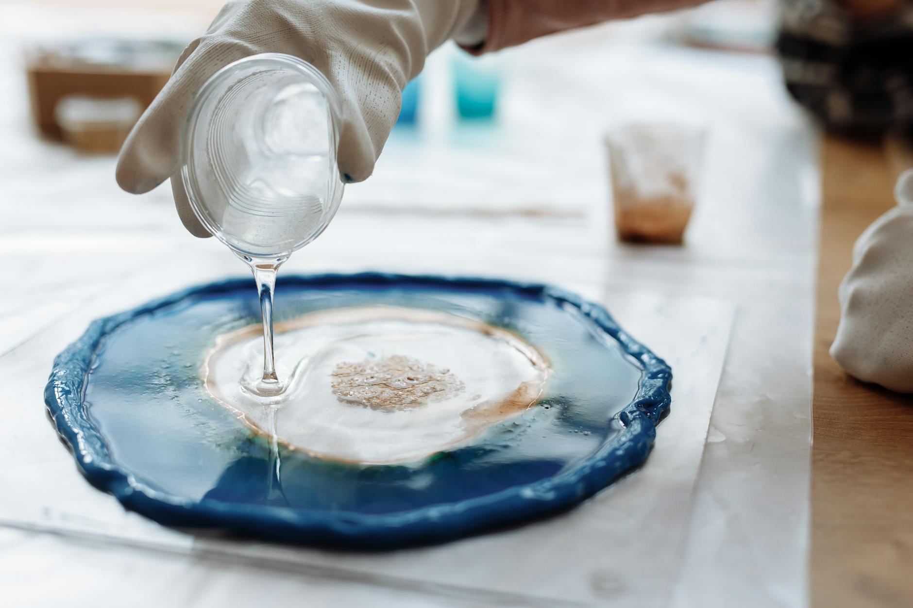 a person pouring resin